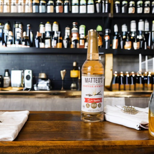 A bottle of Matteo's Vanilla on a cafe countertop 